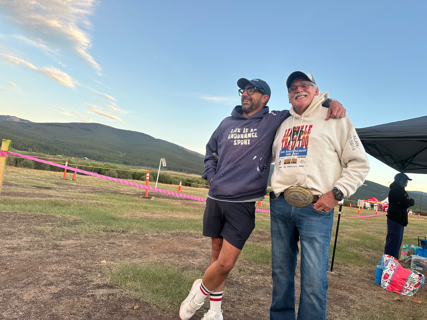 Paul Loper and FKTea co-founder at the Leadville Trail 100 finish, wearing the blue Life Is An Endurance Sport hoodie
